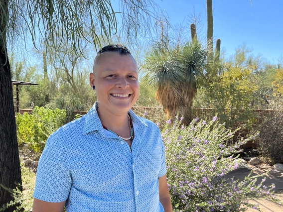 Dr. Piper Sledge photographed in a garden.