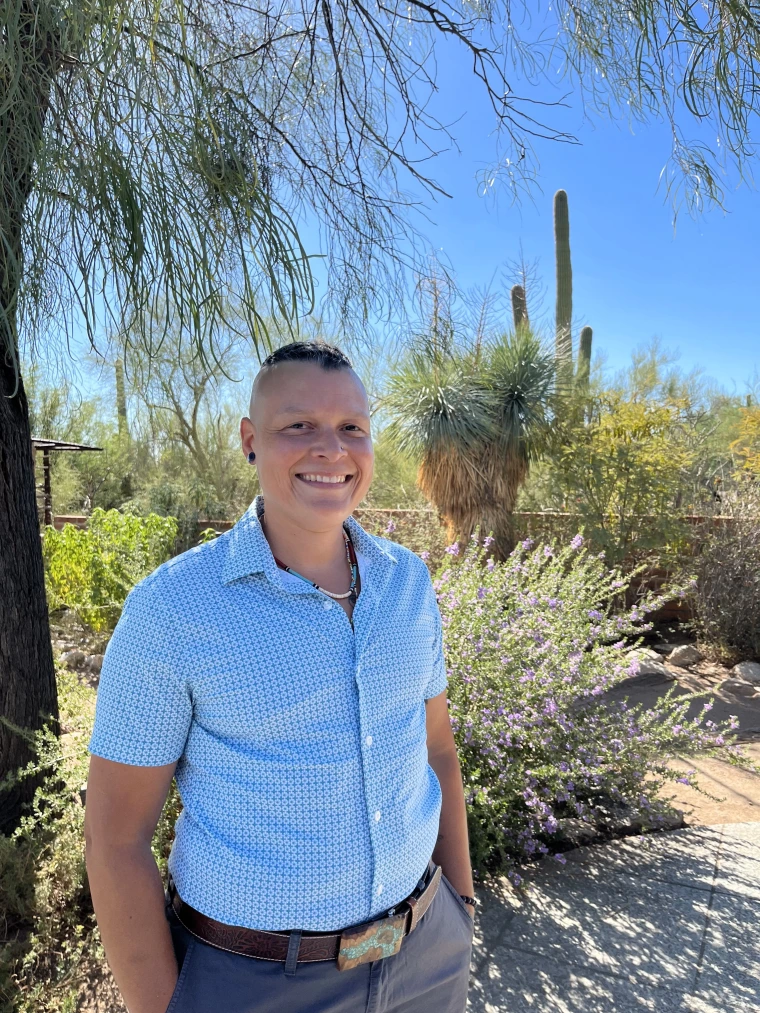 Dr. Piper Sledge photographed in a garden.